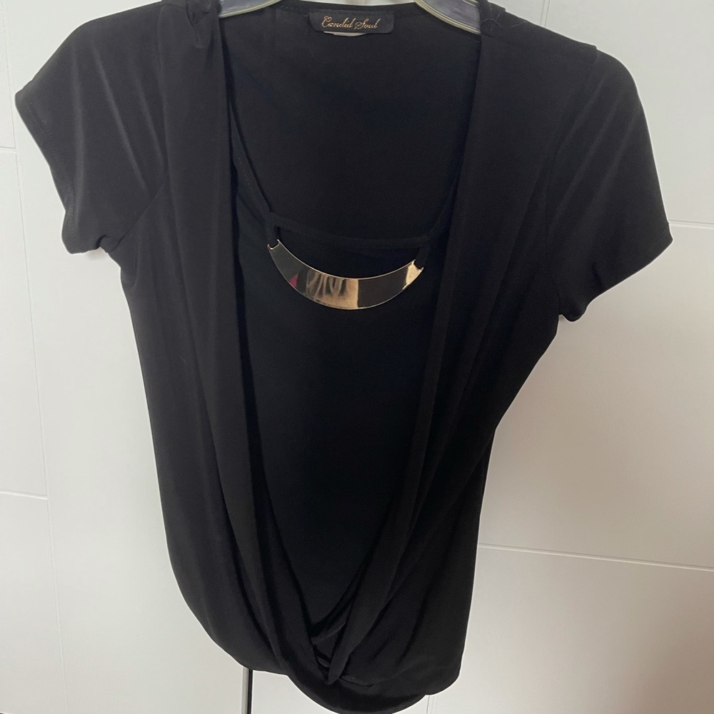 Candies blouse with short sleeves and with golden ornament Size small.
